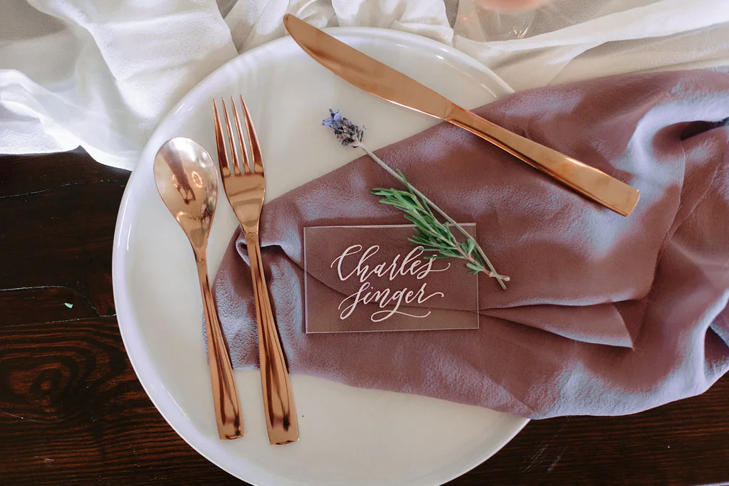 calligraphy place cards in clear plastic