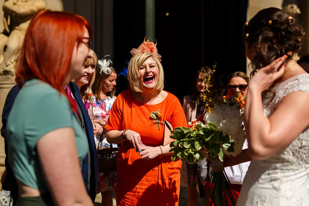 Liverpool wedding with guest in wedding hat
