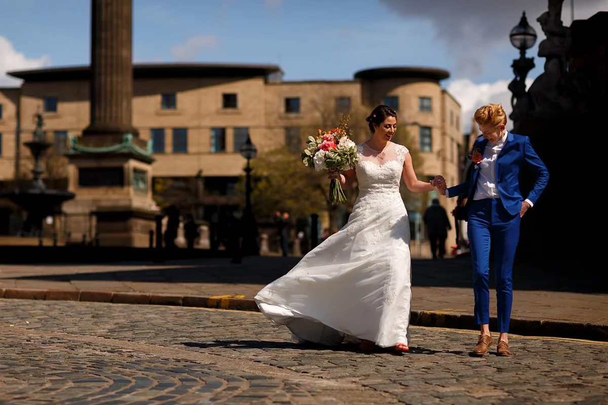 Brides on the street in Liverpool at their wedding
