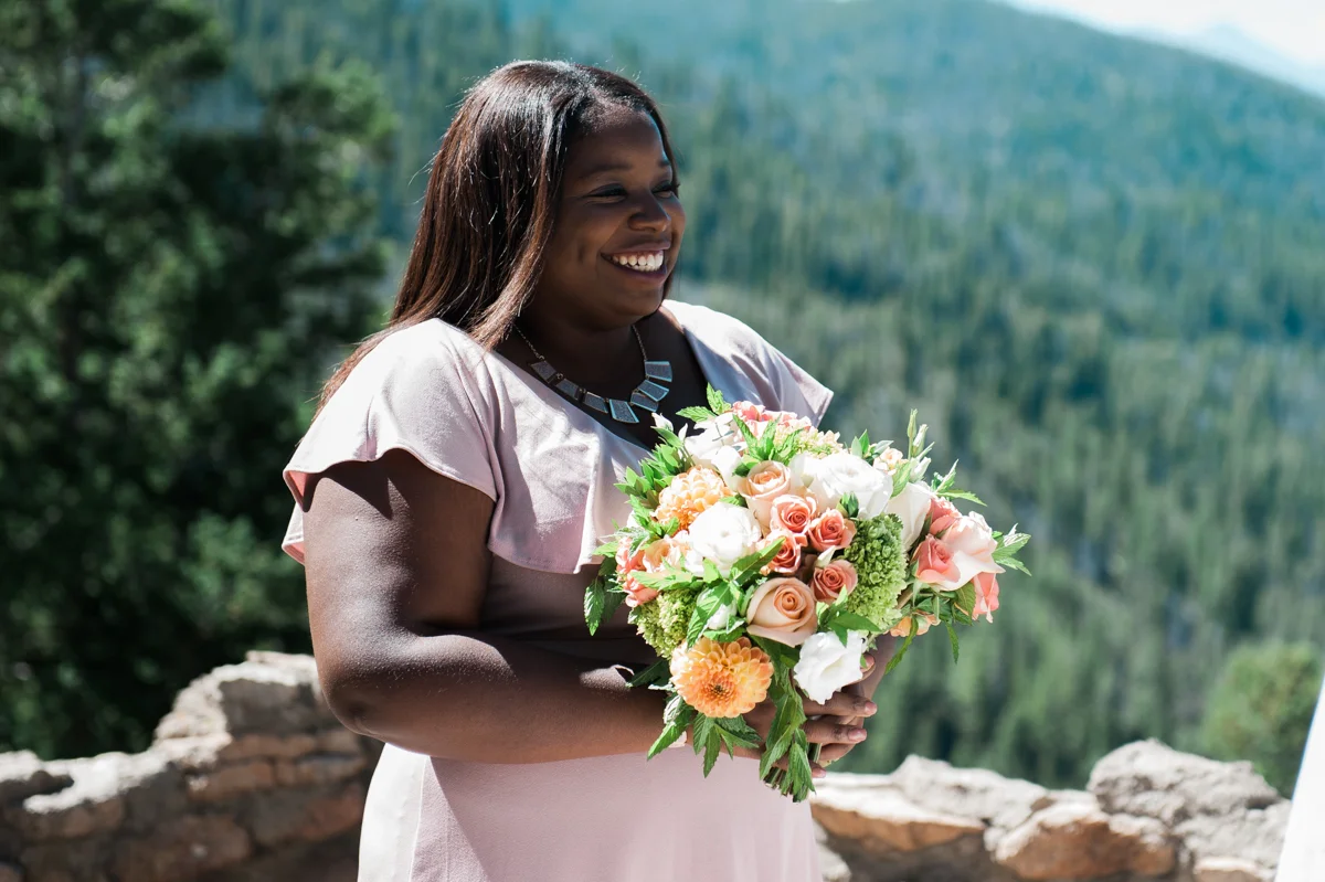 mountain elopement smiling bridesmaid