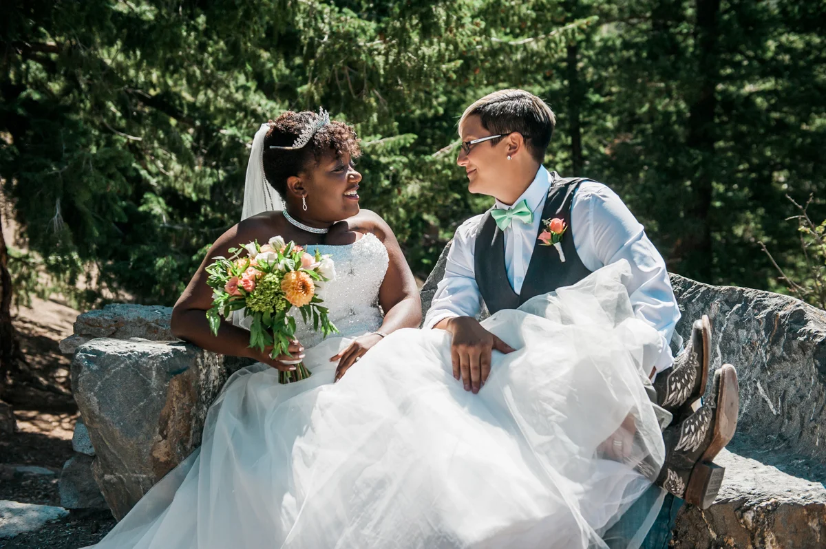 mountain elopement couple seated on rocks