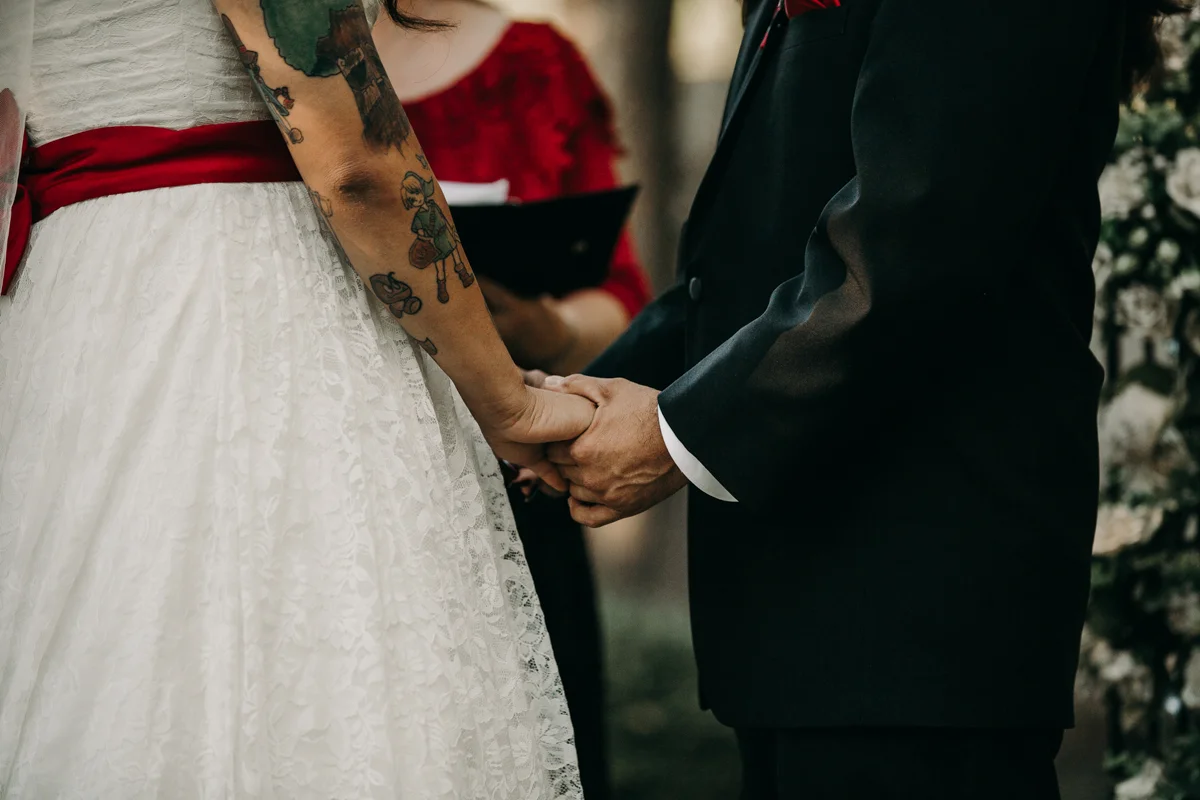 San antonio garden wedding holding hands at altar