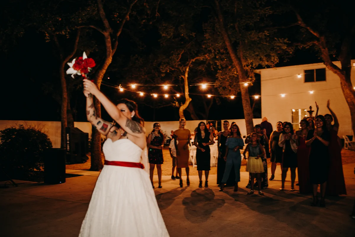 San antonio garden wedding bride tossing bouquet