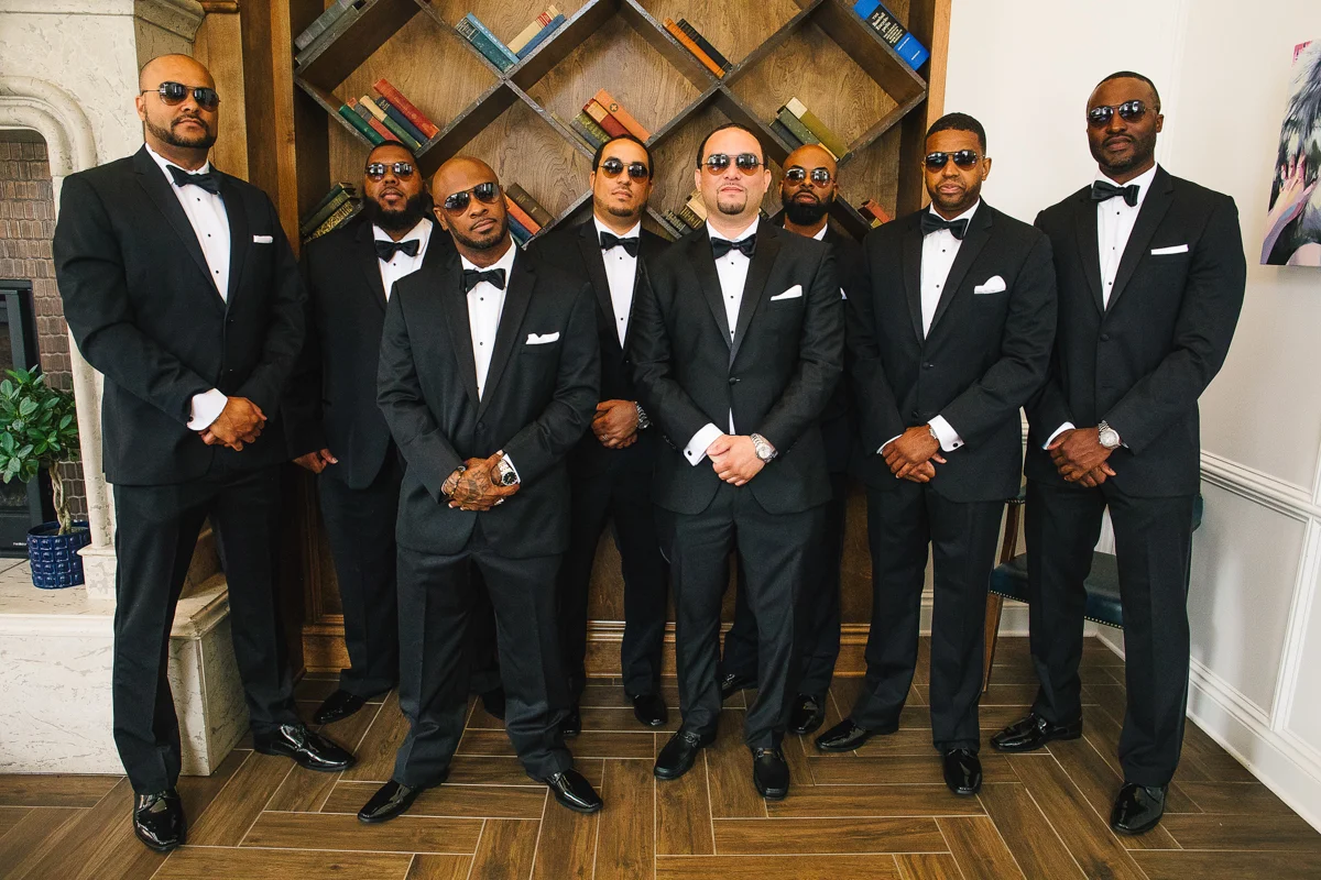 mount vernon ballroom wedding groom and groomsmen posing in sunglasses