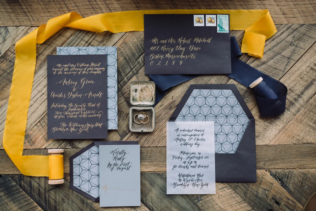 williamsburg hotel wedding shoot invitation layout with coordinating ribbon spools