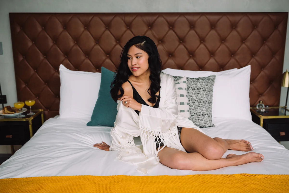 williamsburg hotel wedding shoot bride on bed