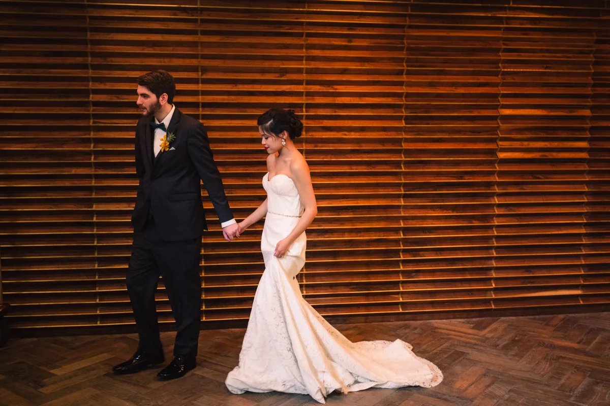 williamsburg hotel wedding shoot bride and groom holding hands