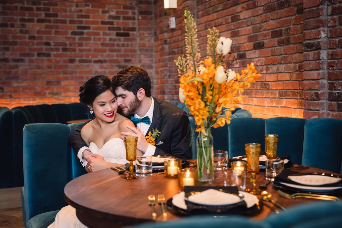 williamsburg hotel wedding shoot couple in booth