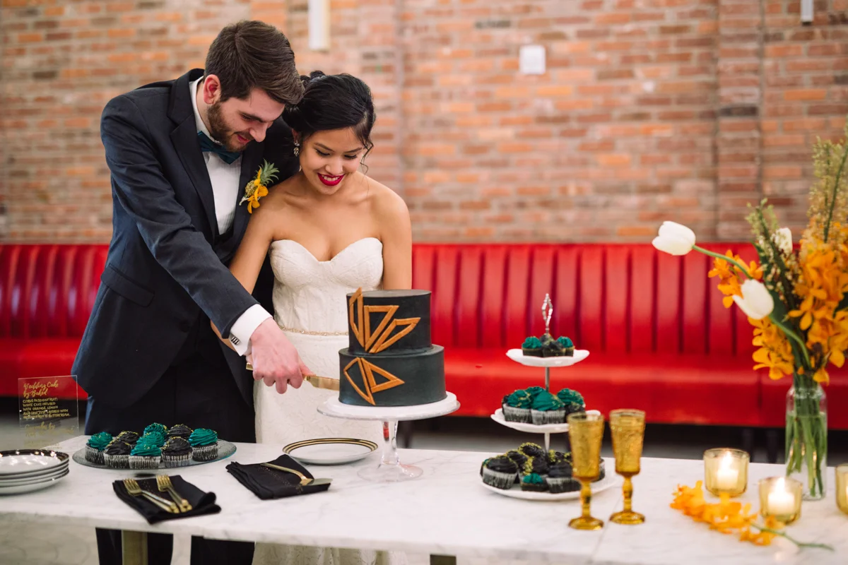 williamsburg hotel wedding shoot couple cutting cake