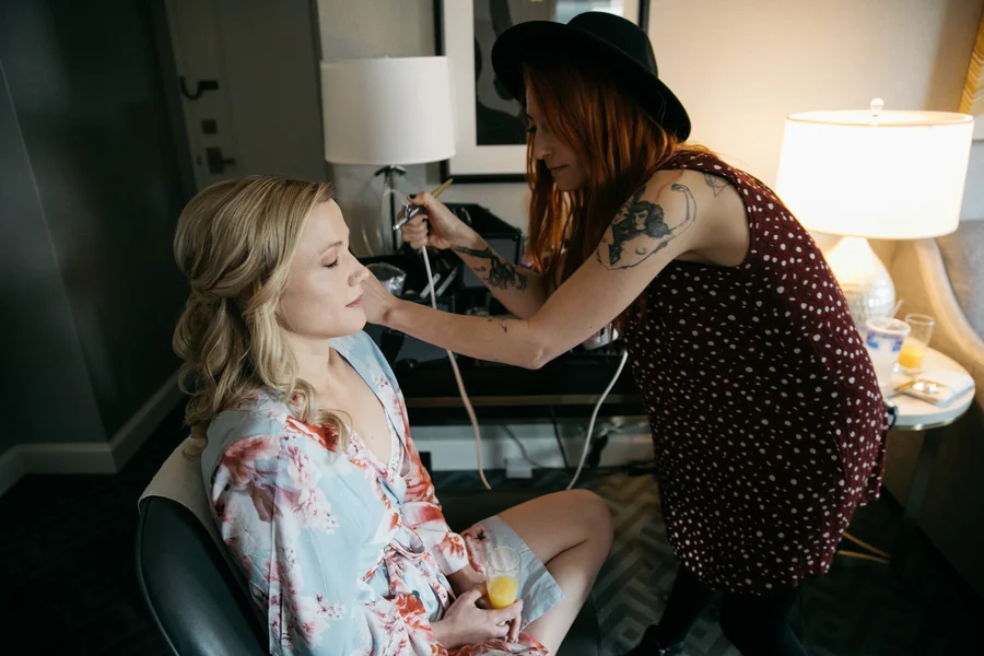 ARIN AND KATIE DOWNTOWN SEATTLE WEDDING KATIE GETTING HAIR DONE