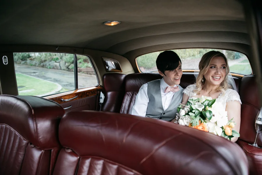 ARIN AND KATIE DOWNTOWN SEATTLE WEDDING COUPLE LOOKING OUT CAR WINDOW