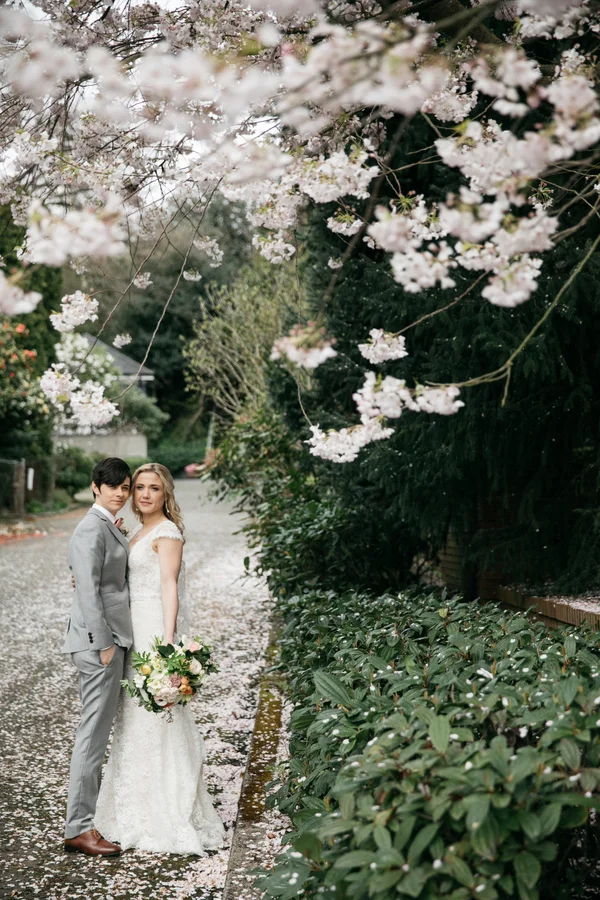 ARIN AND KATIE DOWNTOWN SEATTLE WEDDING COUPLE UNDER BLOSSOMING TREE