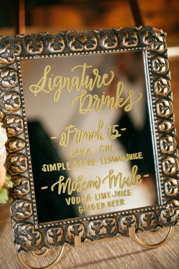 ARIN AND KATIE DOWNTOWN SEATTLE WEDDING list of signature drinks written on mirror