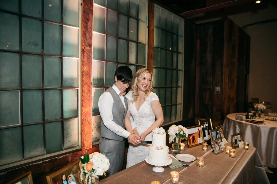 ARIN AND KATIE DOWNTOWN SEATTLE WEDDING cutting cake