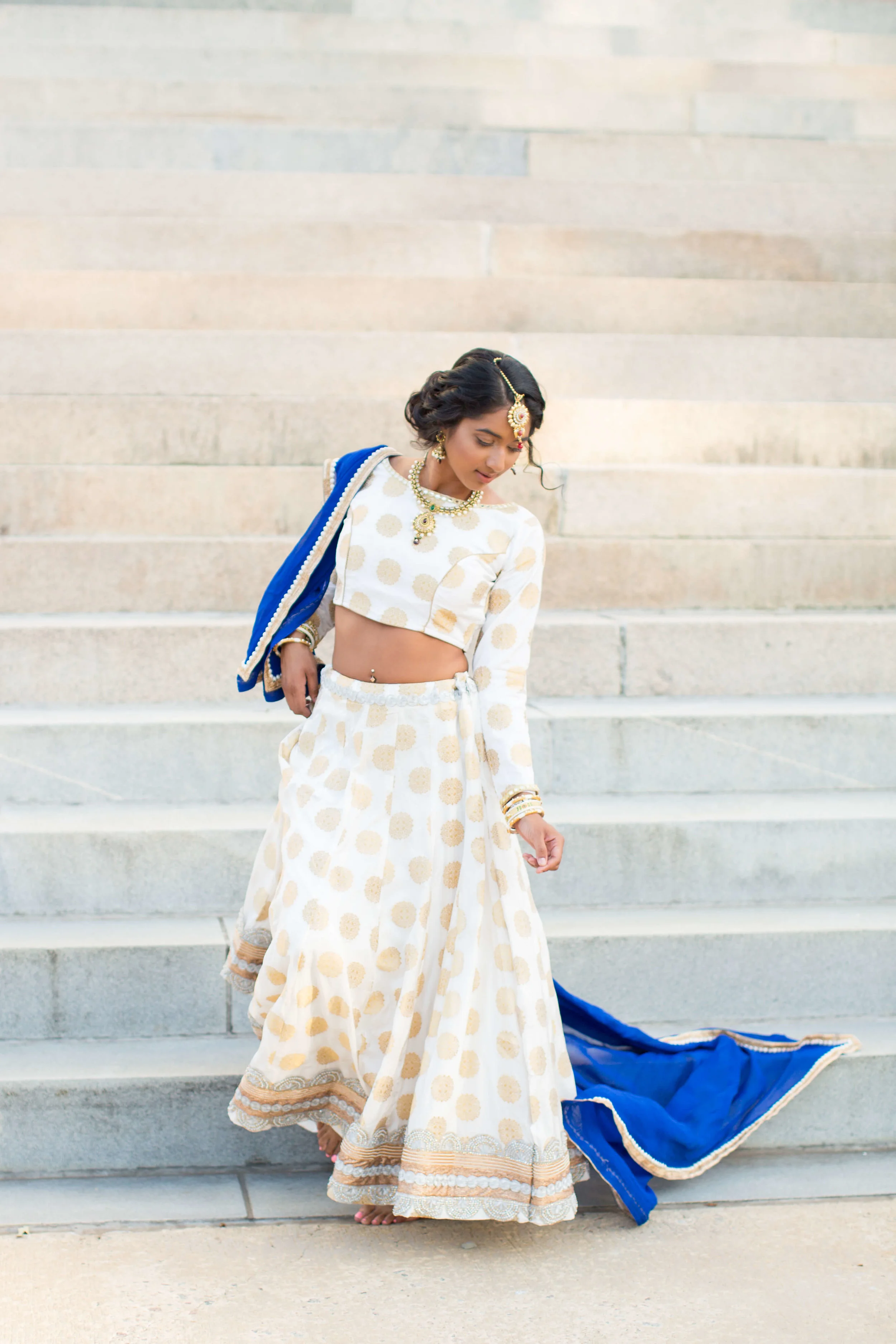 Bride wearing traditional wedding saree dancing on stairs Jessica Hunt Photography Southeast US Weddings