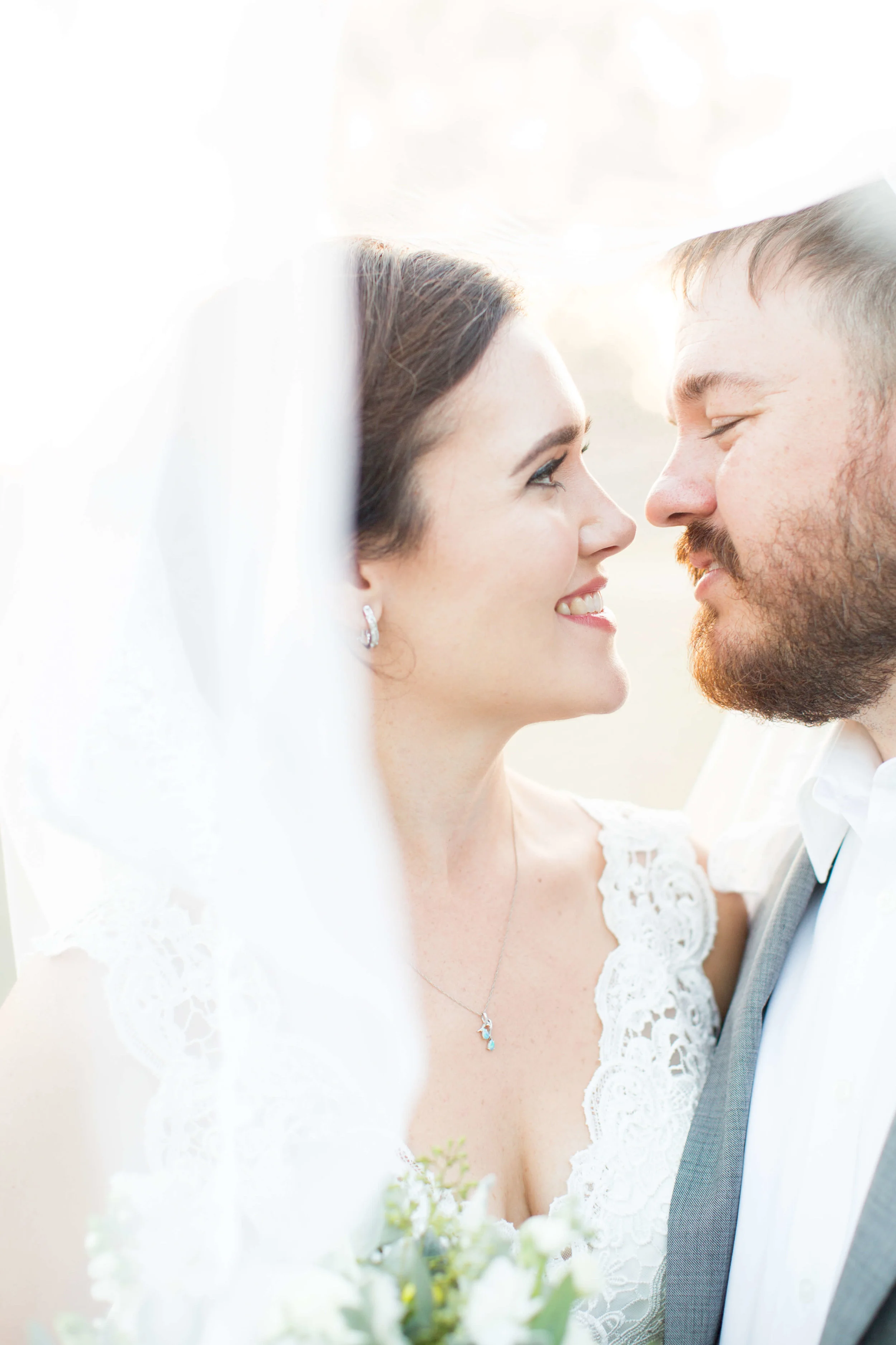 Portrait bride and groom leaning in to kiss Jessica Hunt Photography Southeast US Weddings
