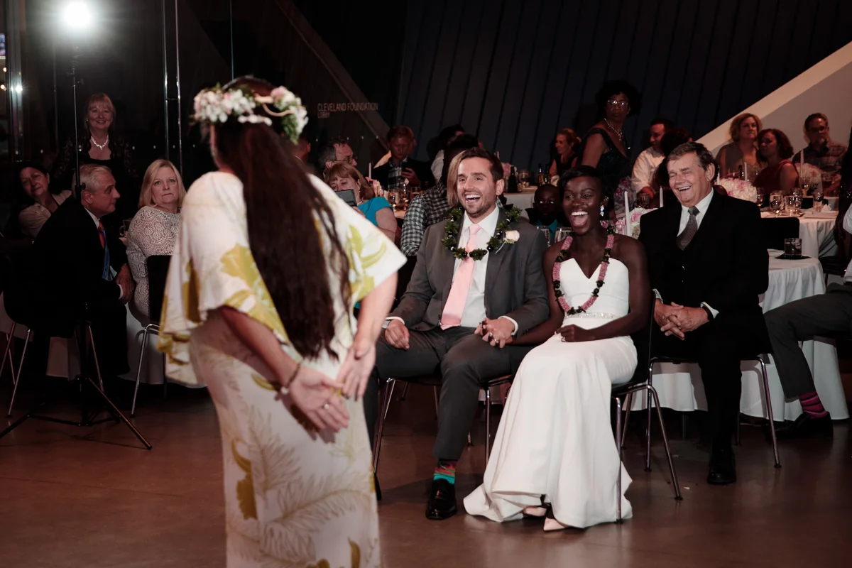 Glam cleveland museum wedding couple and guests watching tahitian dance ceremony