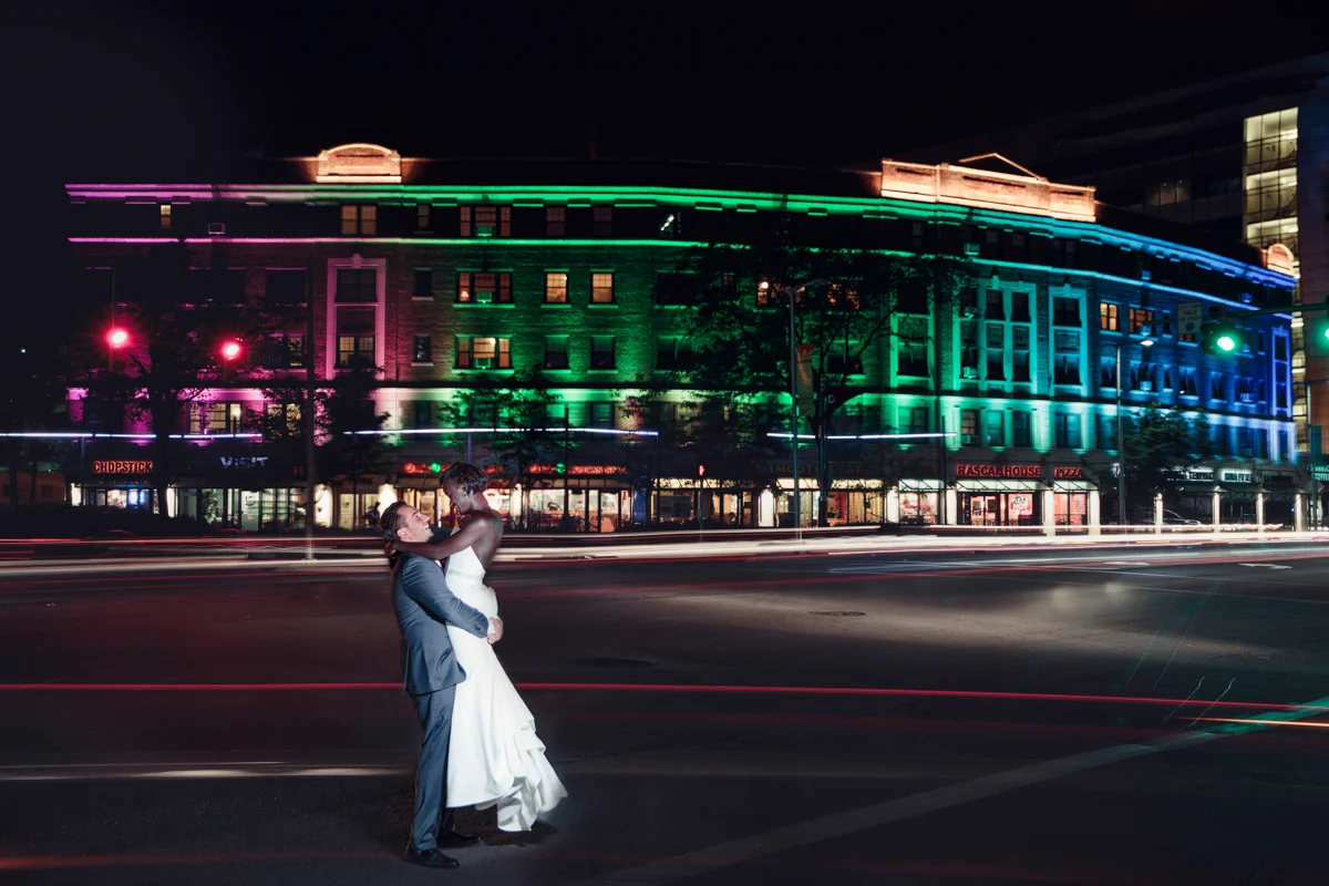 Glam cleveland museum wedding william lifting gloria on sidewalk