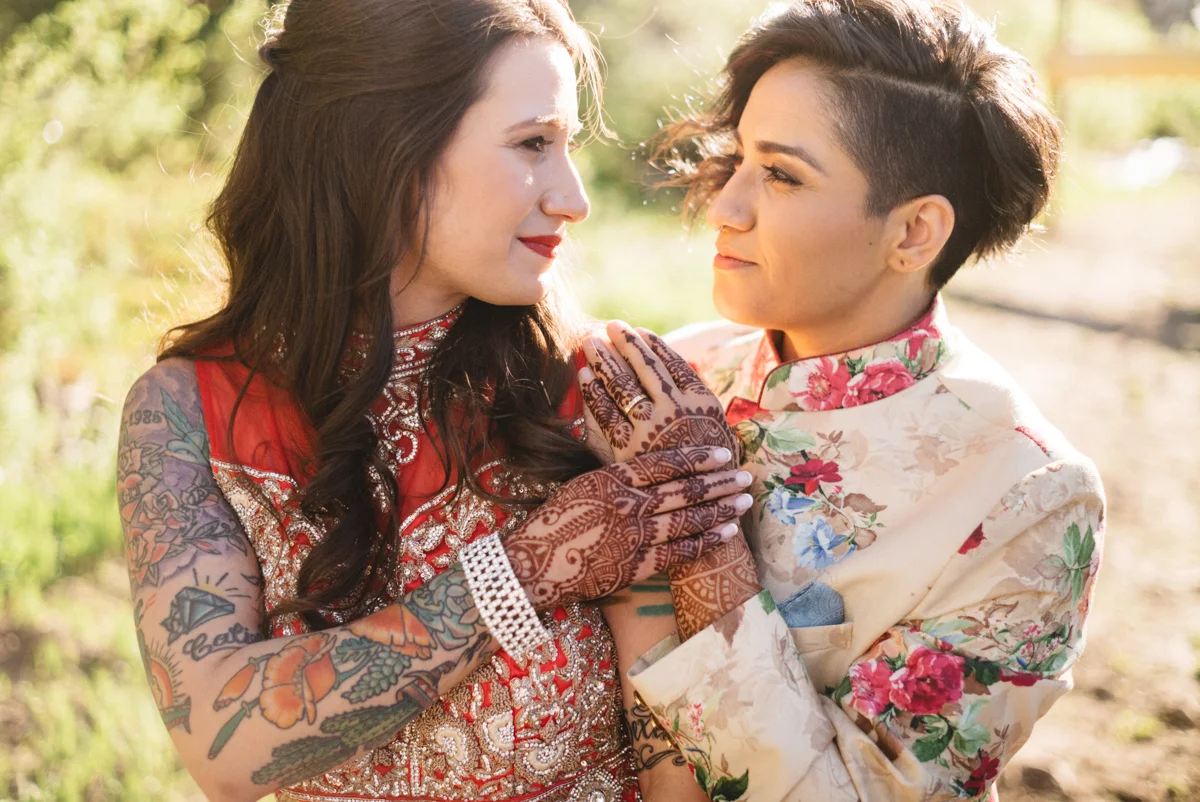 DENVER SAME-SEX INDIAN WEDDING BRIDES HOLDING HANDS