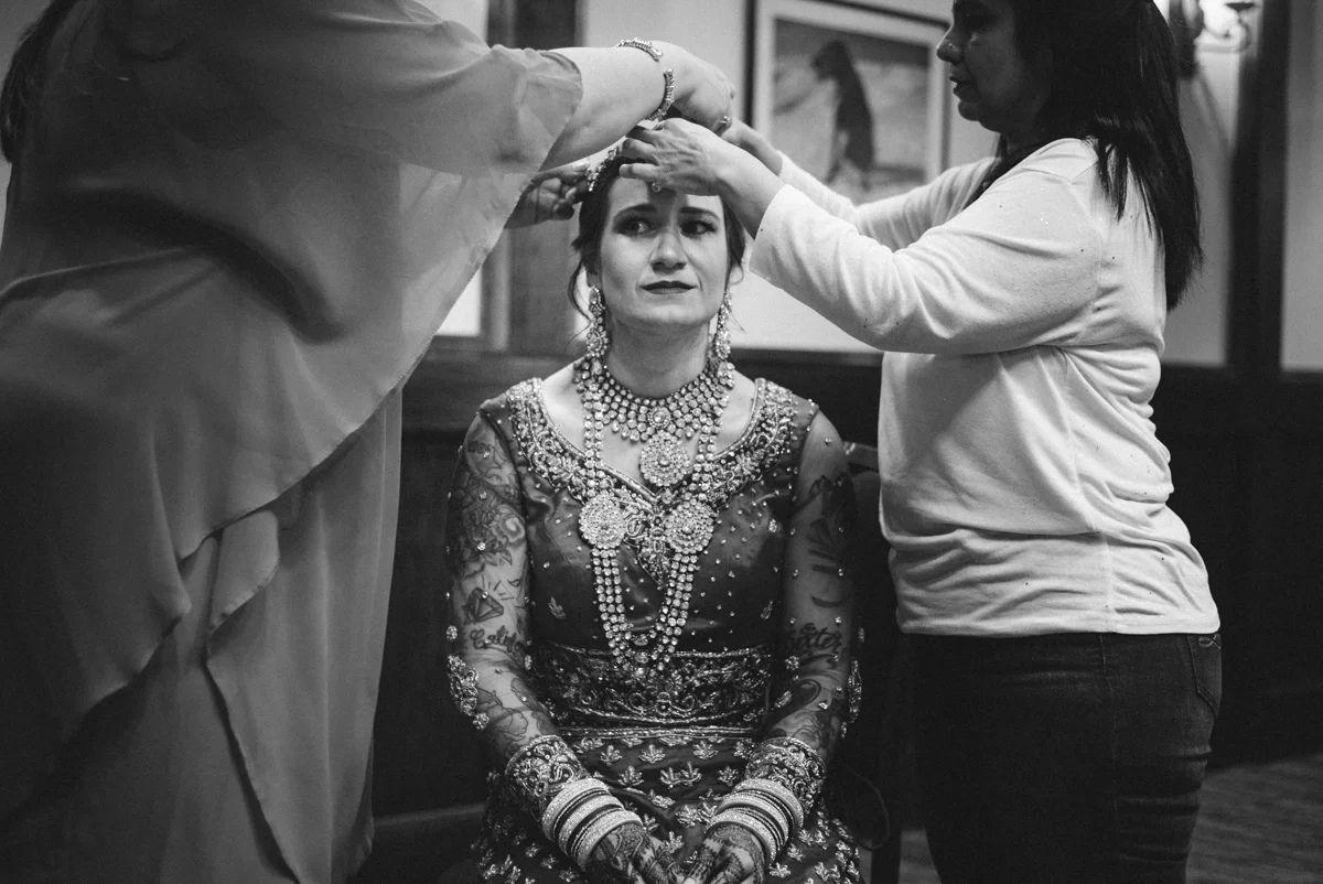 Denver Same-Sex Indian Wedding albertine having maang tikka put on