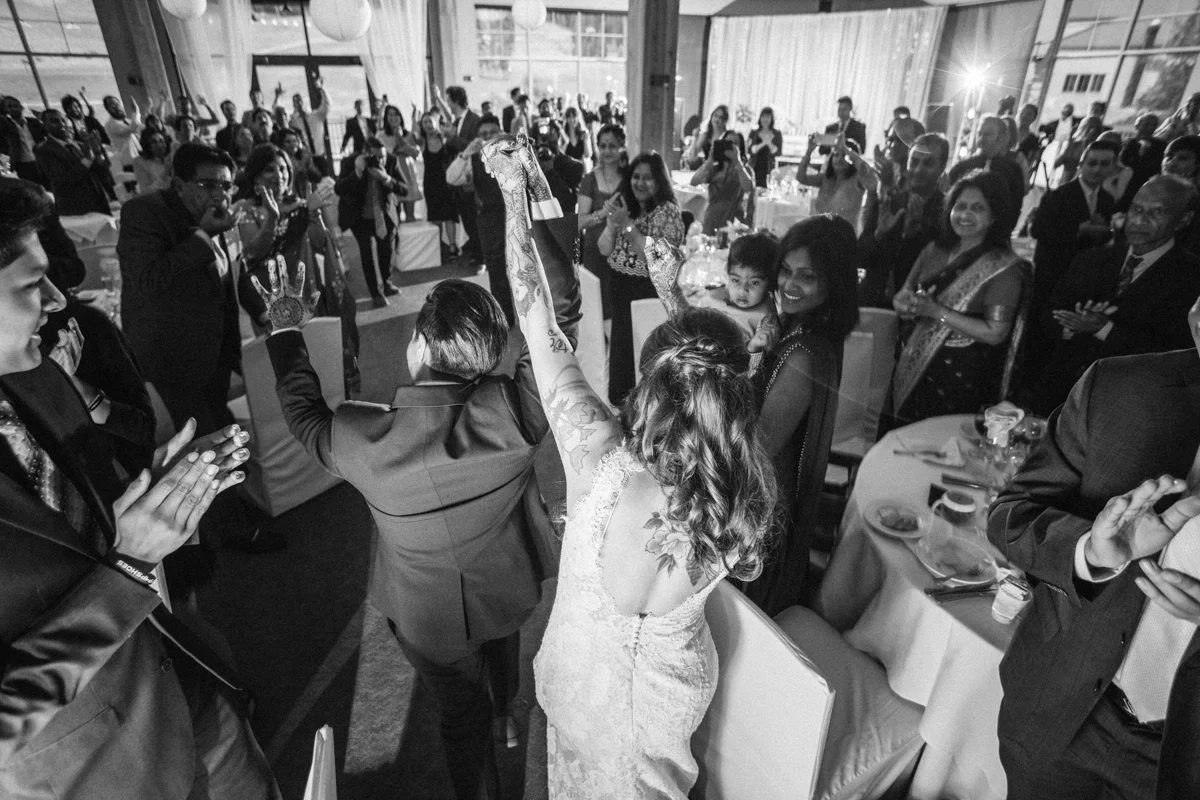denver same-sex indian wedding newlyweds entering reception