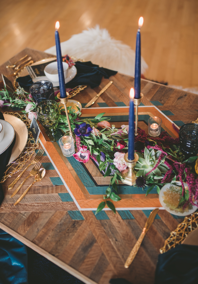 we are young worth the wait studios candles and place settings on table