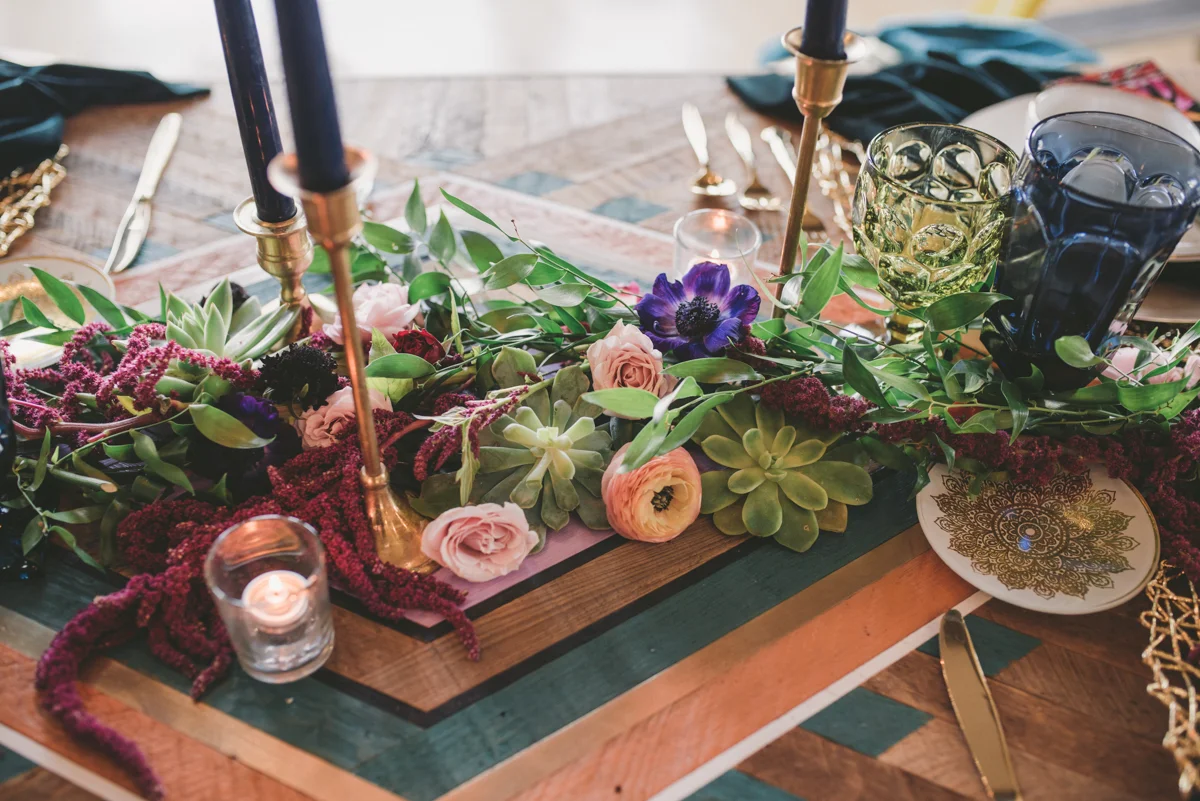 we are young worth the wait studios floral centerpiece and candles