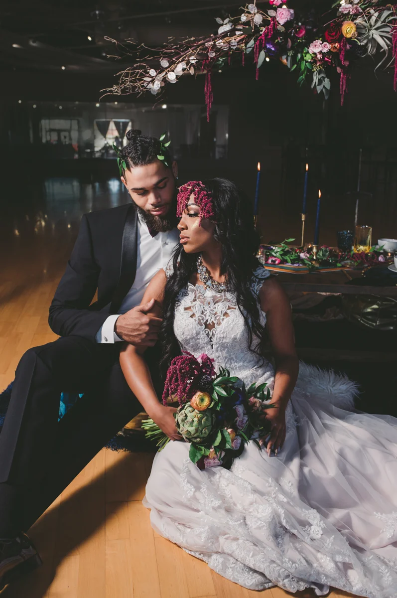 we are young worth the wait studios couple on cushions around table