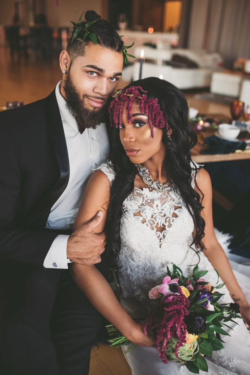 we are young worth the wait studios couple posing on cushions