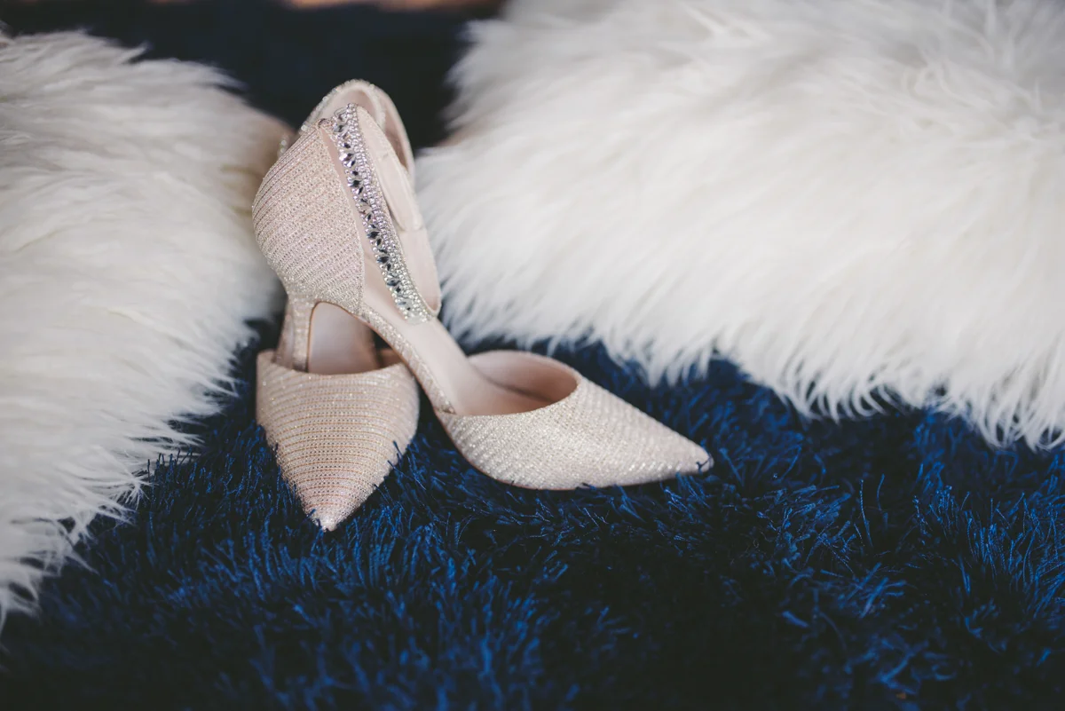 we are young worth the wait studios bride's shoes on fuzzy carpet