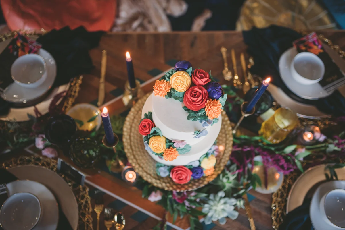 we are young worth the wait studios wedding cake on table