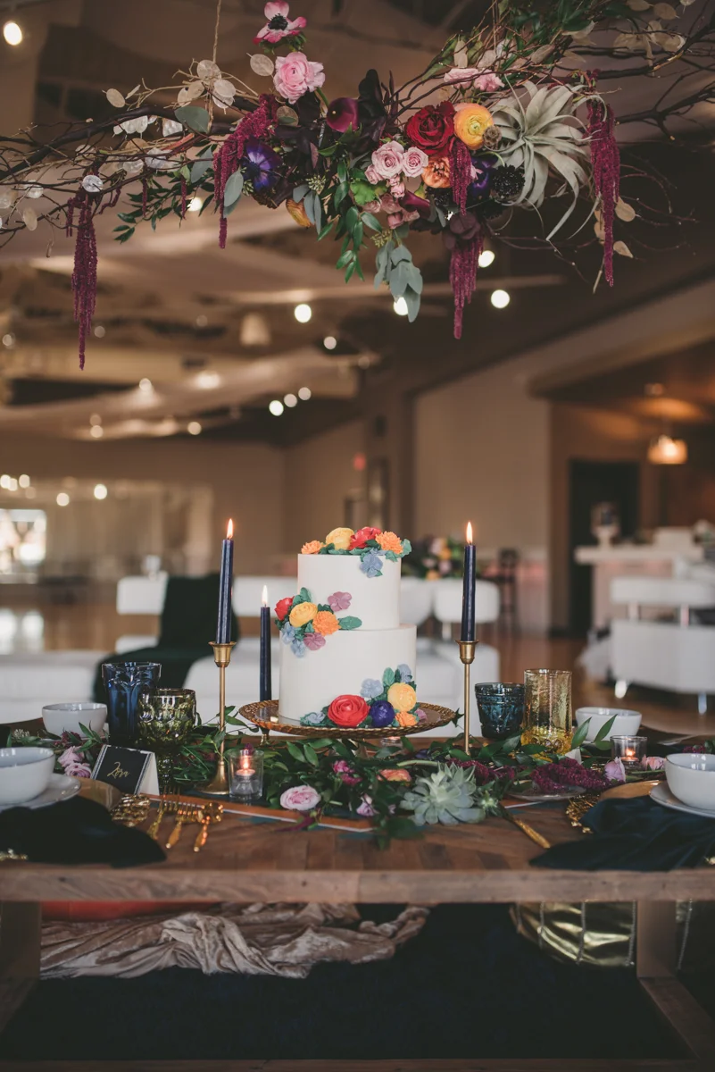 we are young worth the wait studios set table with cake