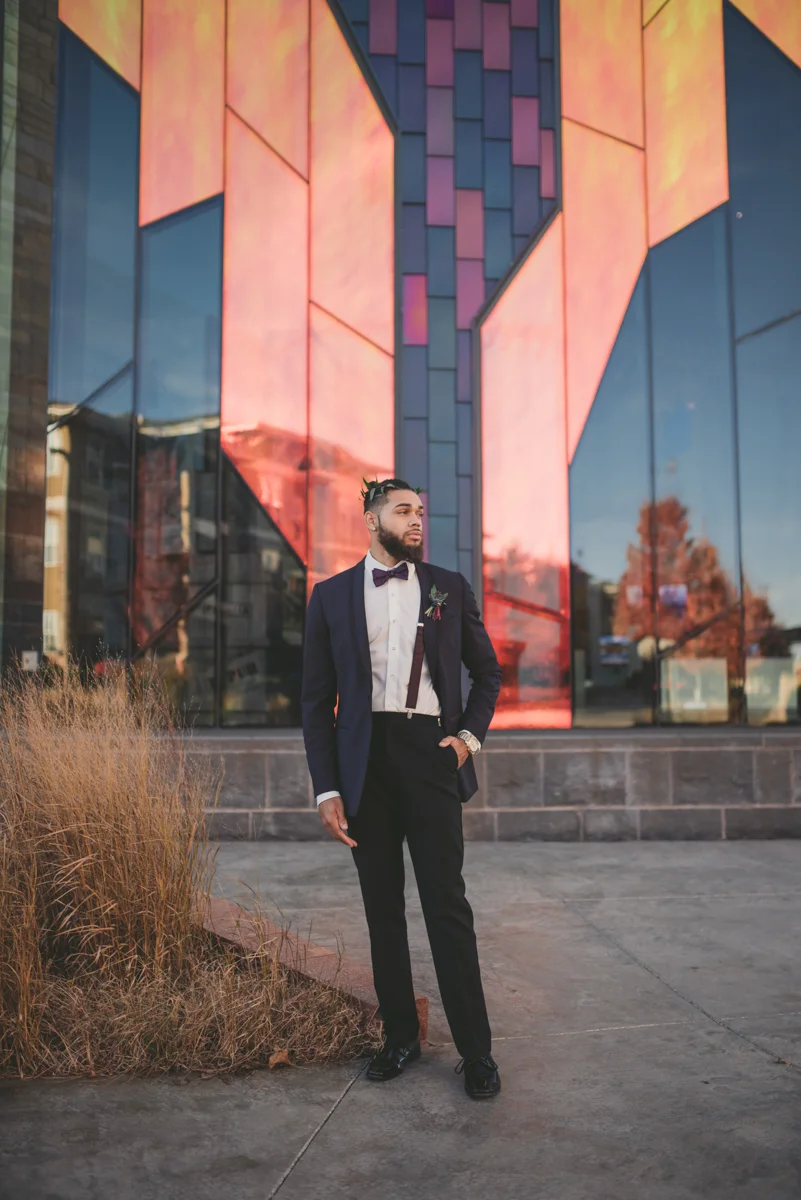 we are young worth the wait studios groom outside glass building