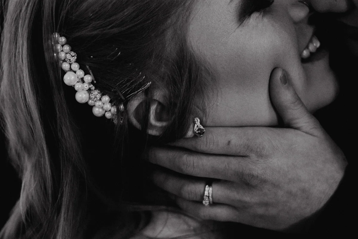 Rustic italian wedding close-up on embrace, candess's hair pin, jess's ring