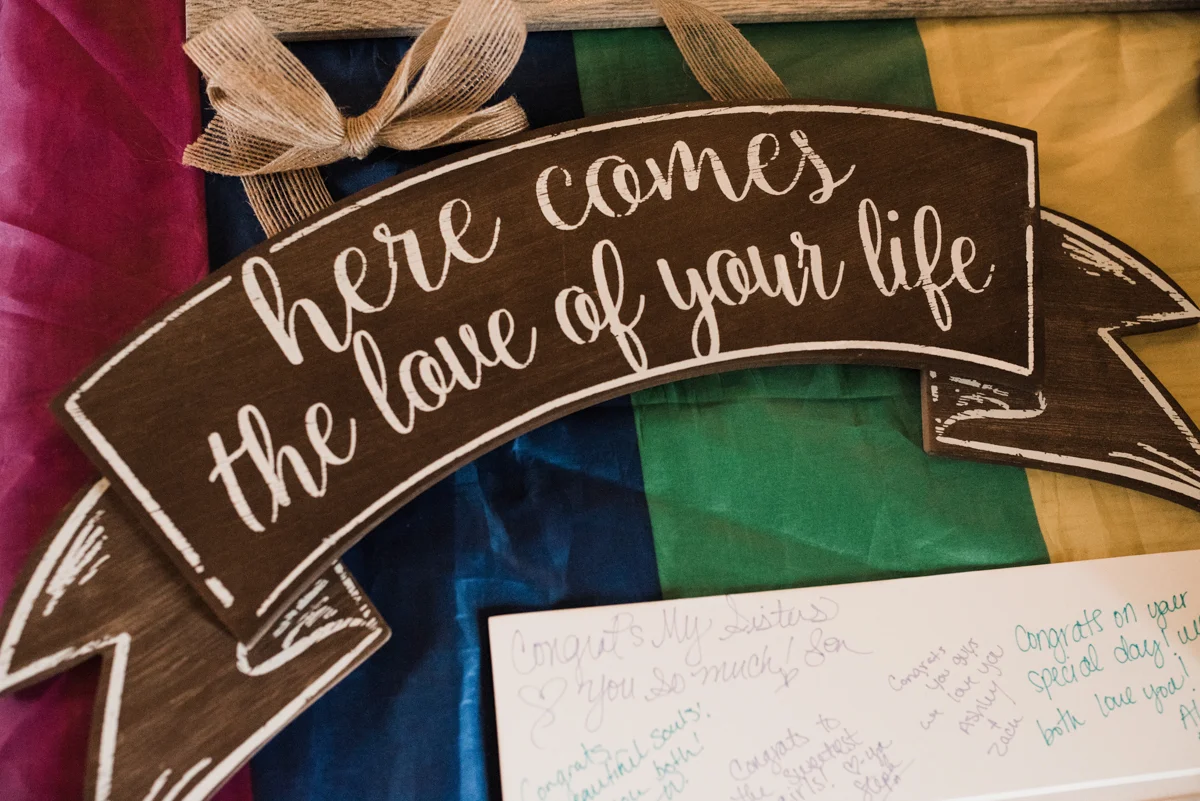 Rustic italian wedding wooden sign reading "here comes the love of your life"