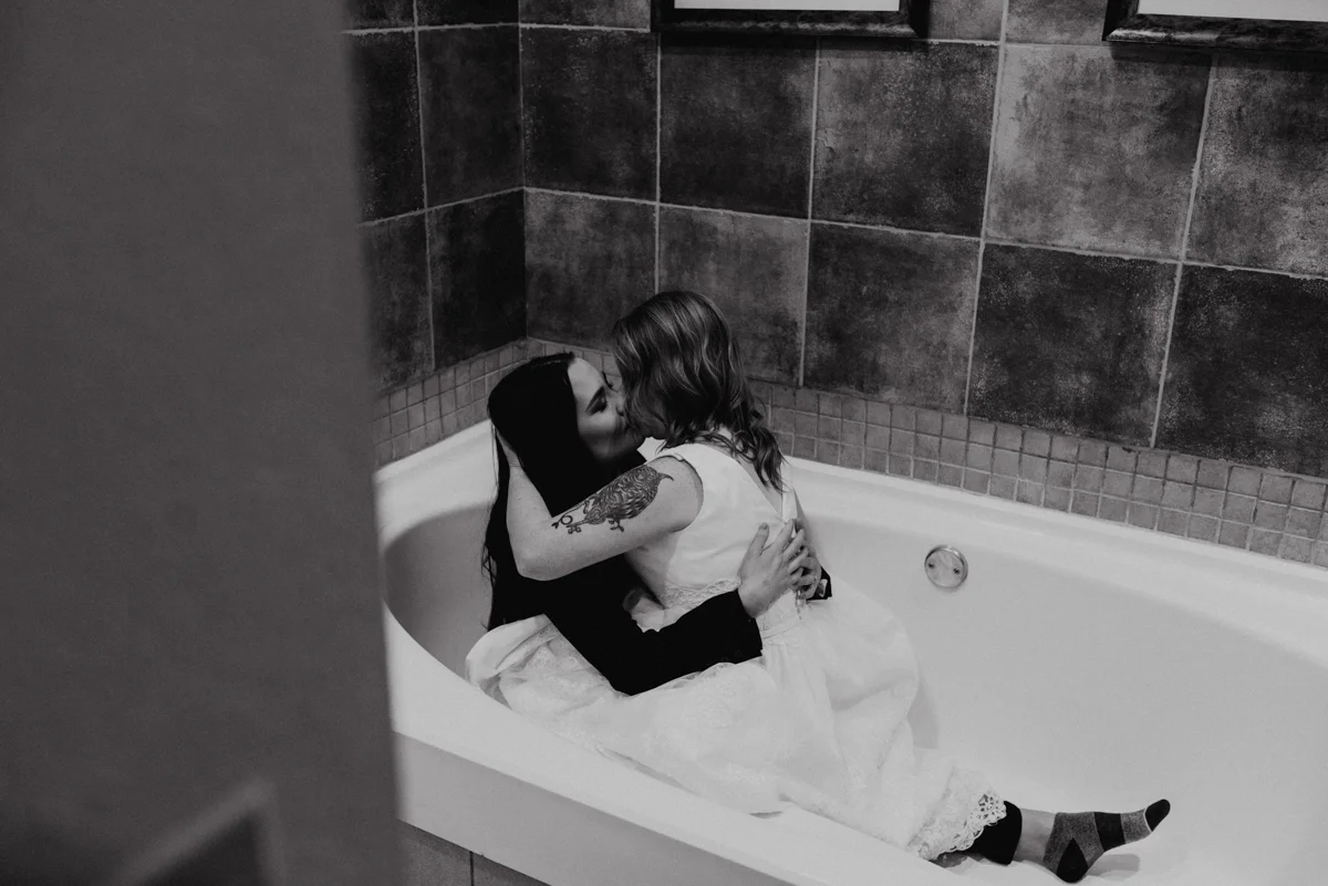 Rustic italian wedding kiss in bathtub