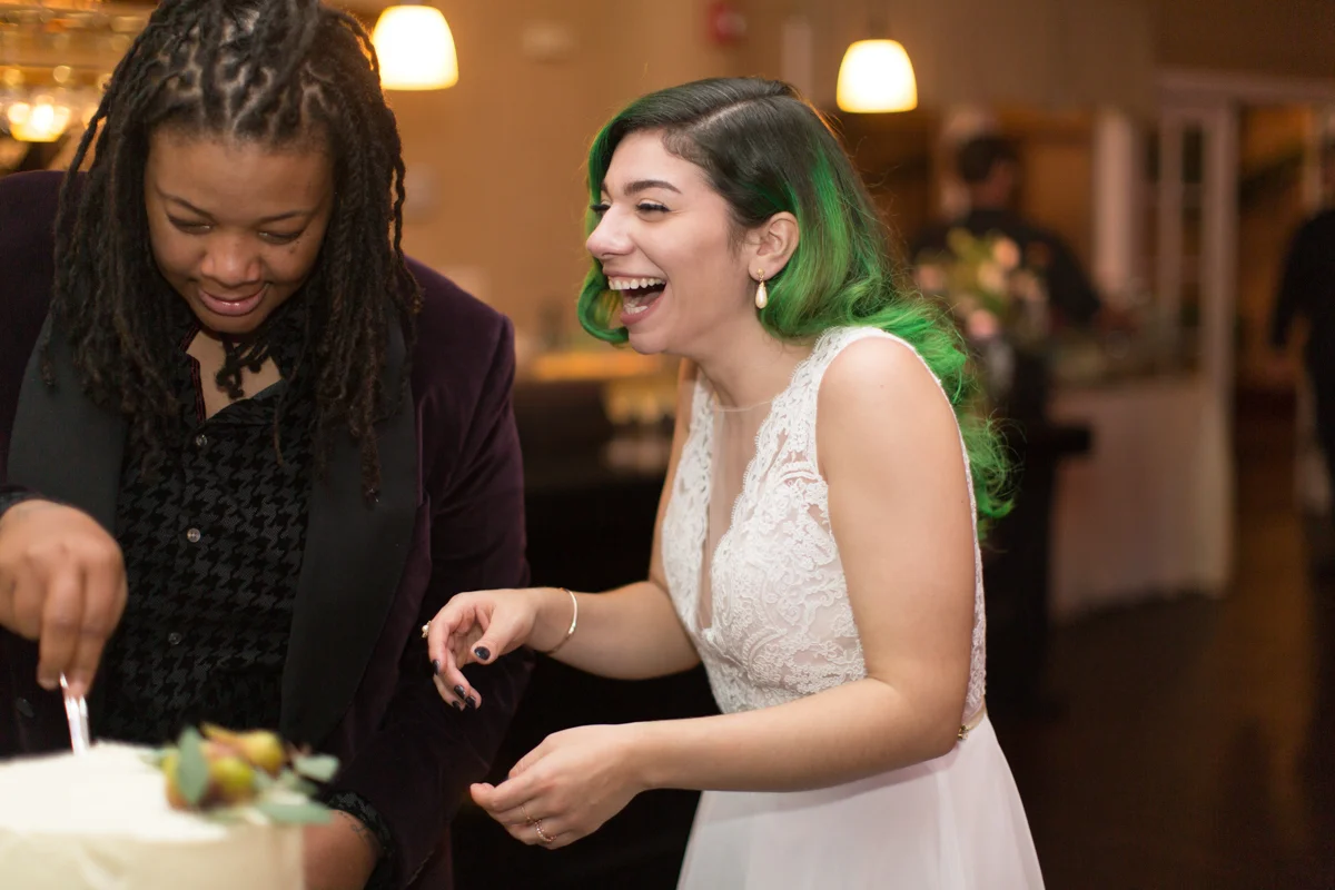 Saint augustine wedding cutting cake, allie laughing