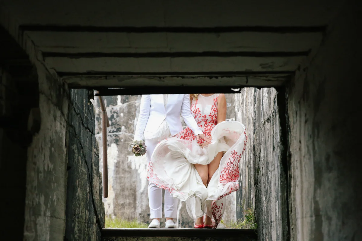 gulf shores destination wedding couple's torsos down shot from lower stairwell