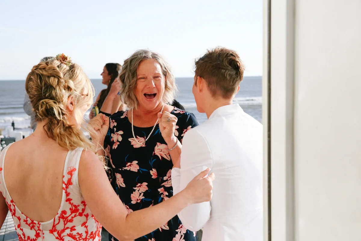 gulf shores destination wedding mom excited talking to couple