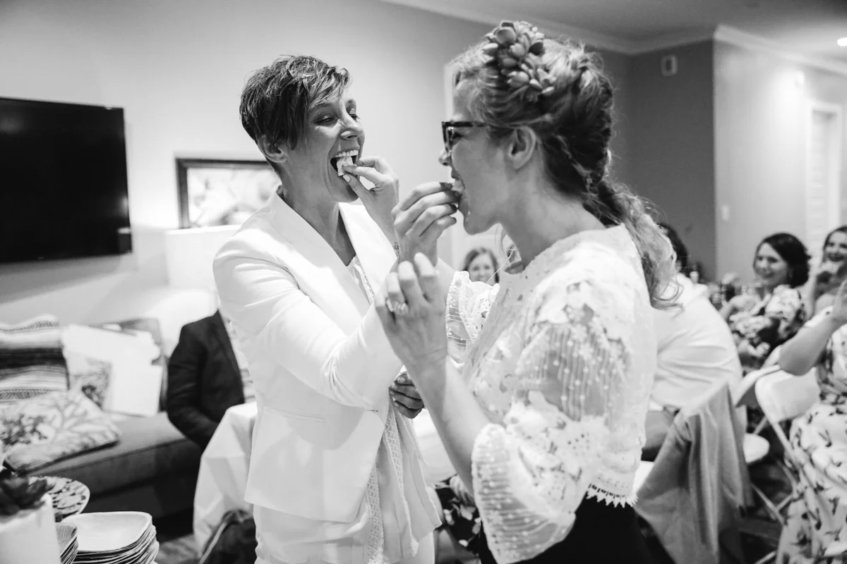gulf shores destination wedding kate and ajay feeding each other cake