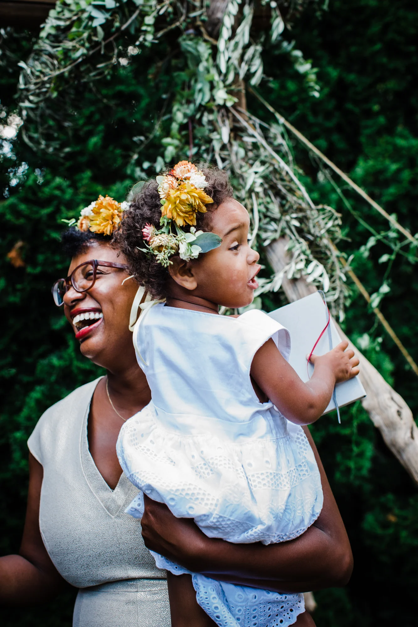 Bride holding her baby with matching floral headband Corey Torpie Photography NYC