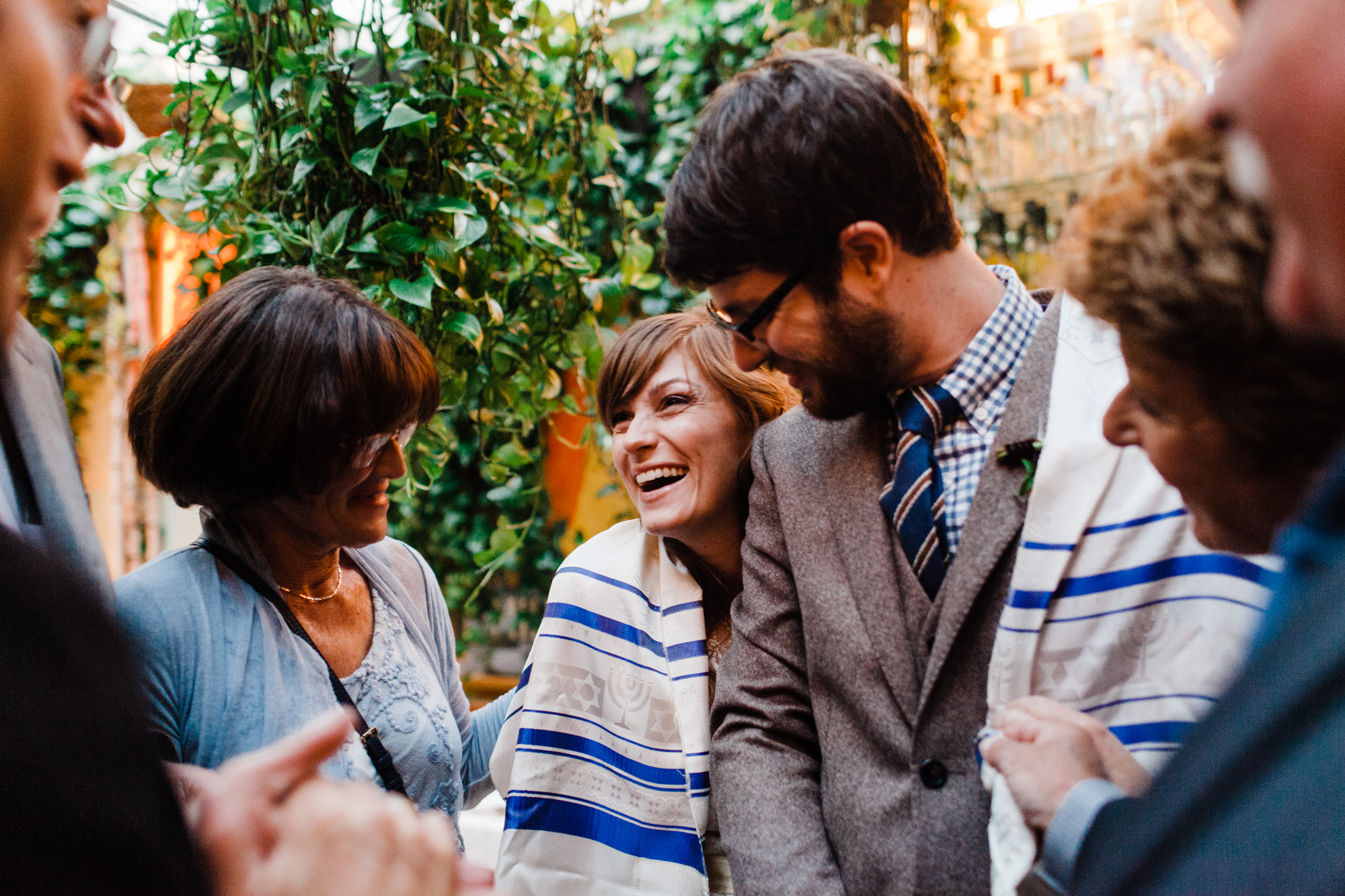 Couple holding each other smiling surrounded by wedding guests Corey Torpie Photography NYC
