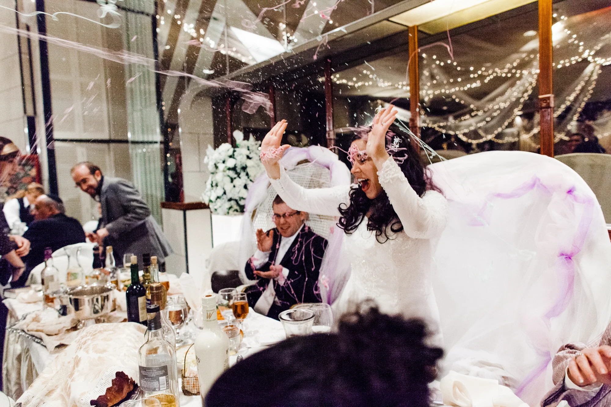 Newlywed couple being showered by silly string at wedding reception Corey Torpie Photography NYC
