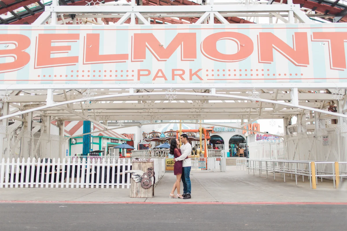 belmont park engagement session san diego angela and jamie under belmont park sign