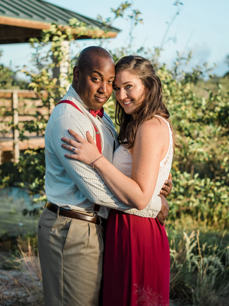 BOCA RATON ENGAGEMENT SESSION EMBRACE IN GARDEN