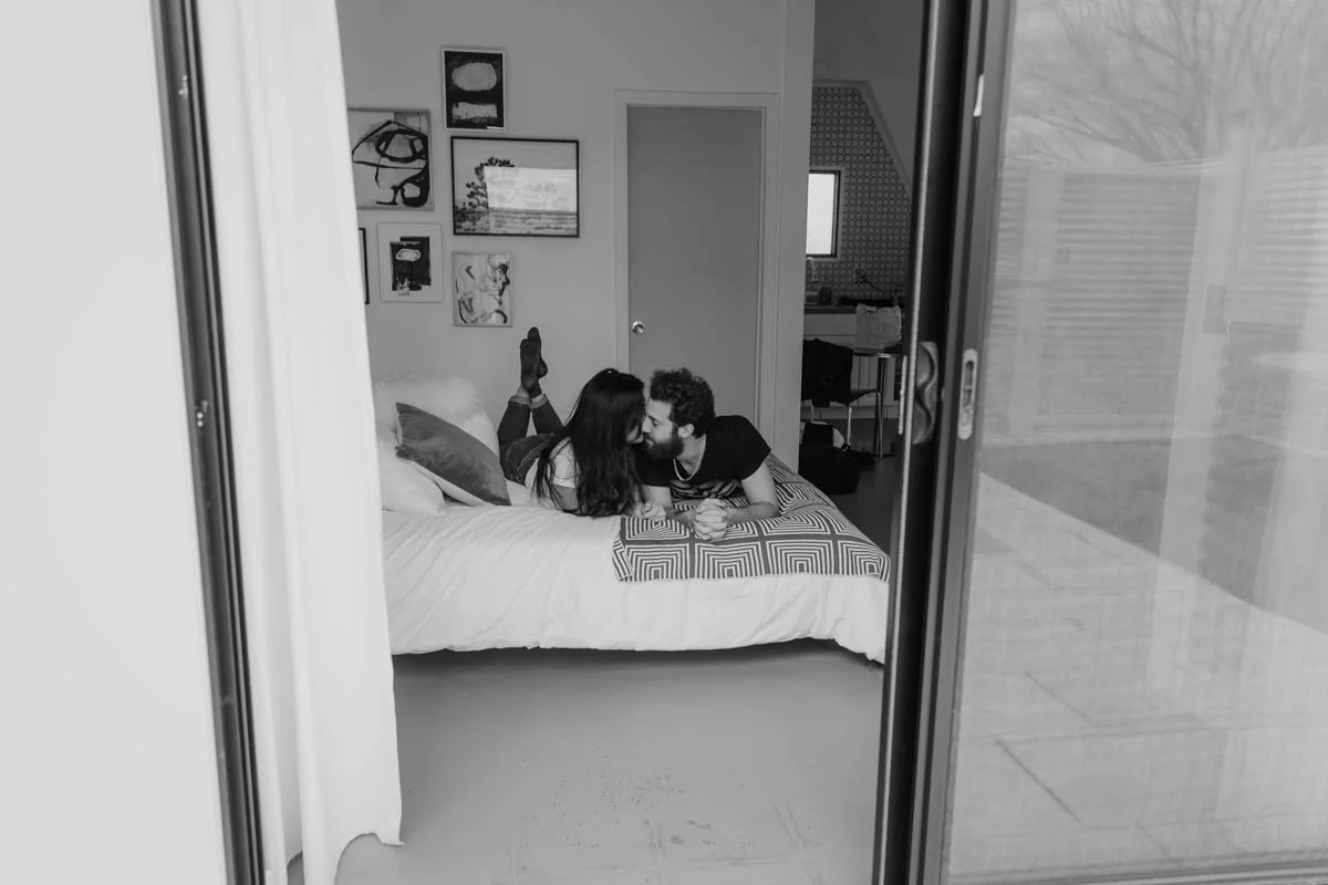 joshua tree california engagement session couple on bed shot from doorway