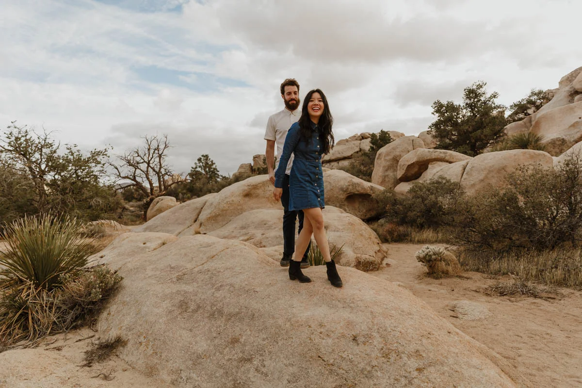 joshua tree california engagement session couple on rock