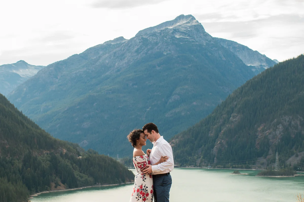 Diablo lake engagement session lyanna and michael embrace with mountains in background