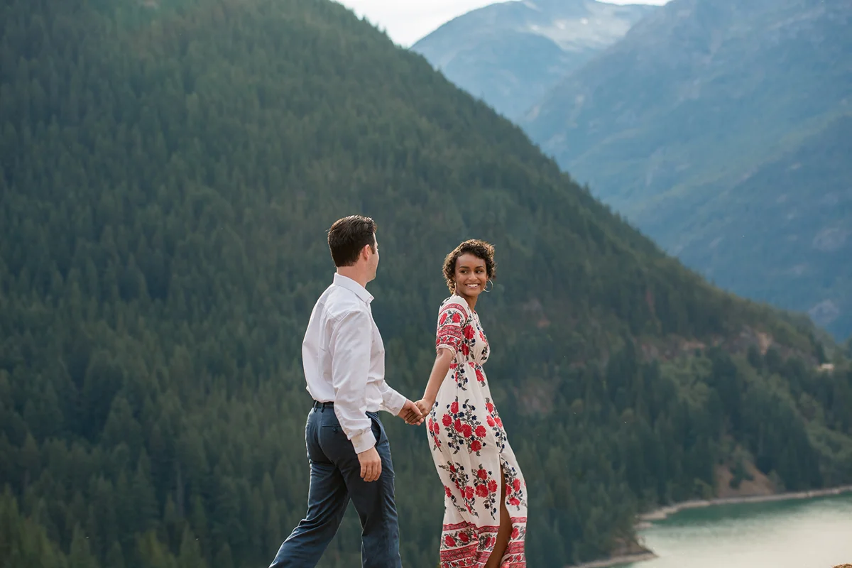 Diablo lake engagement session lyanna leading michael along by the hand