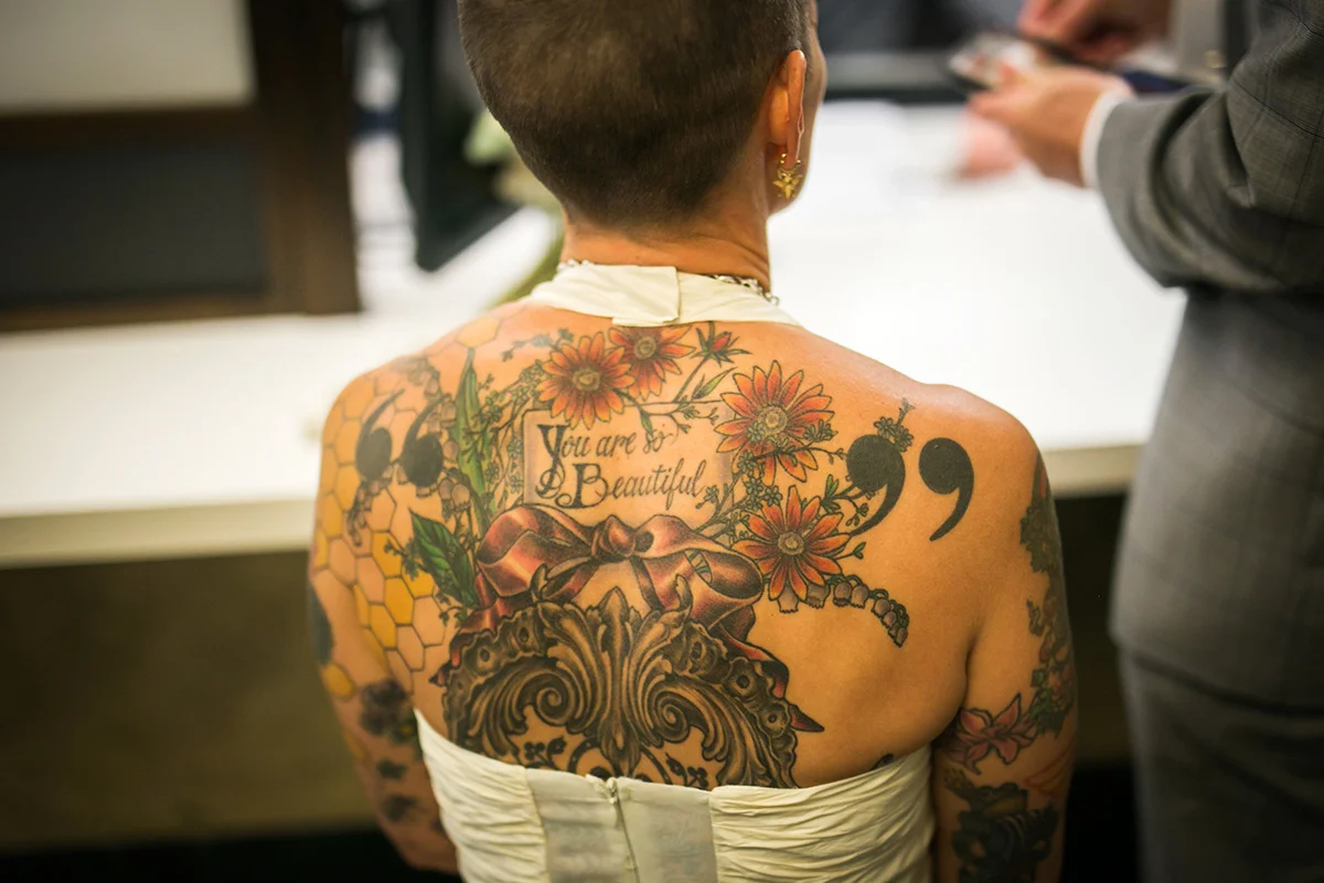 tattooed feminist elopement nyc inger's back tattoos visible in halter-neck dress